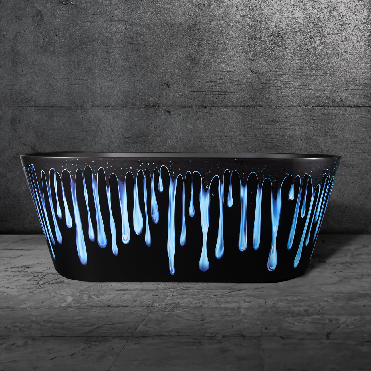 The Brainpod 2.0 Commercial is a matte black acrylic freestanding cold plunge tub with blue and white paint drips on the rim, displayed against a gray textured wall and marble floor.