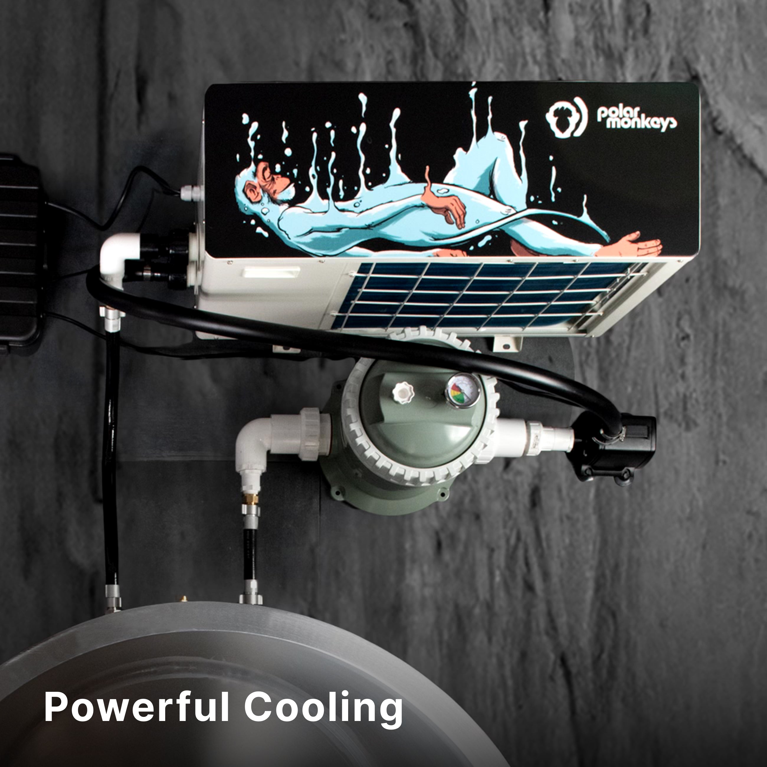 A wall-mounted air conditioning unit with a painted image of a relaxed person floating in water, branded polar monkeys, is shown above pipes and machinery. The words Powerful Cooling appear at the bottom.