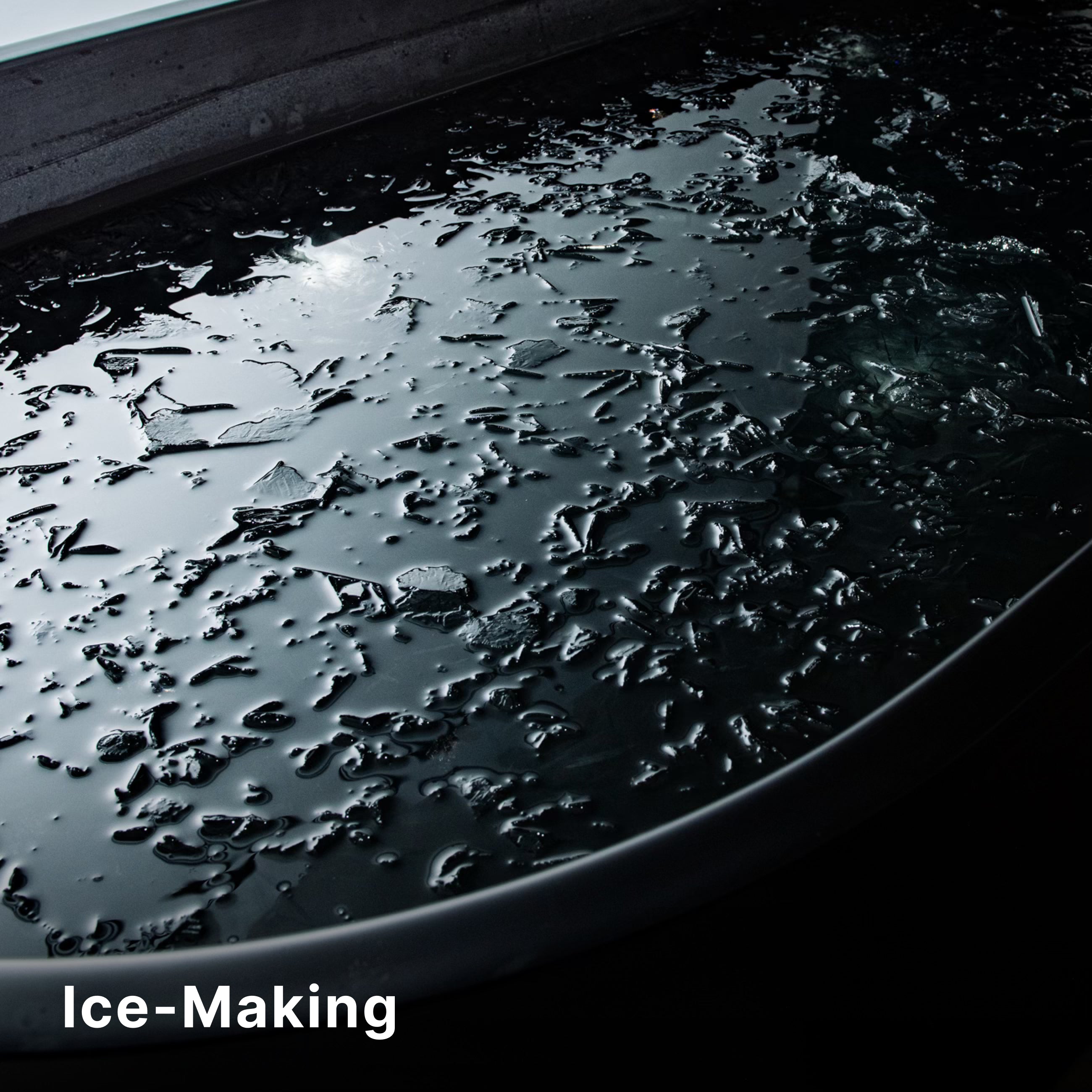 A close-up view of a large, dark container filled with cracked, partially frozen ice pieces. The word Ice-Making appears in white text at the bottom left corner.