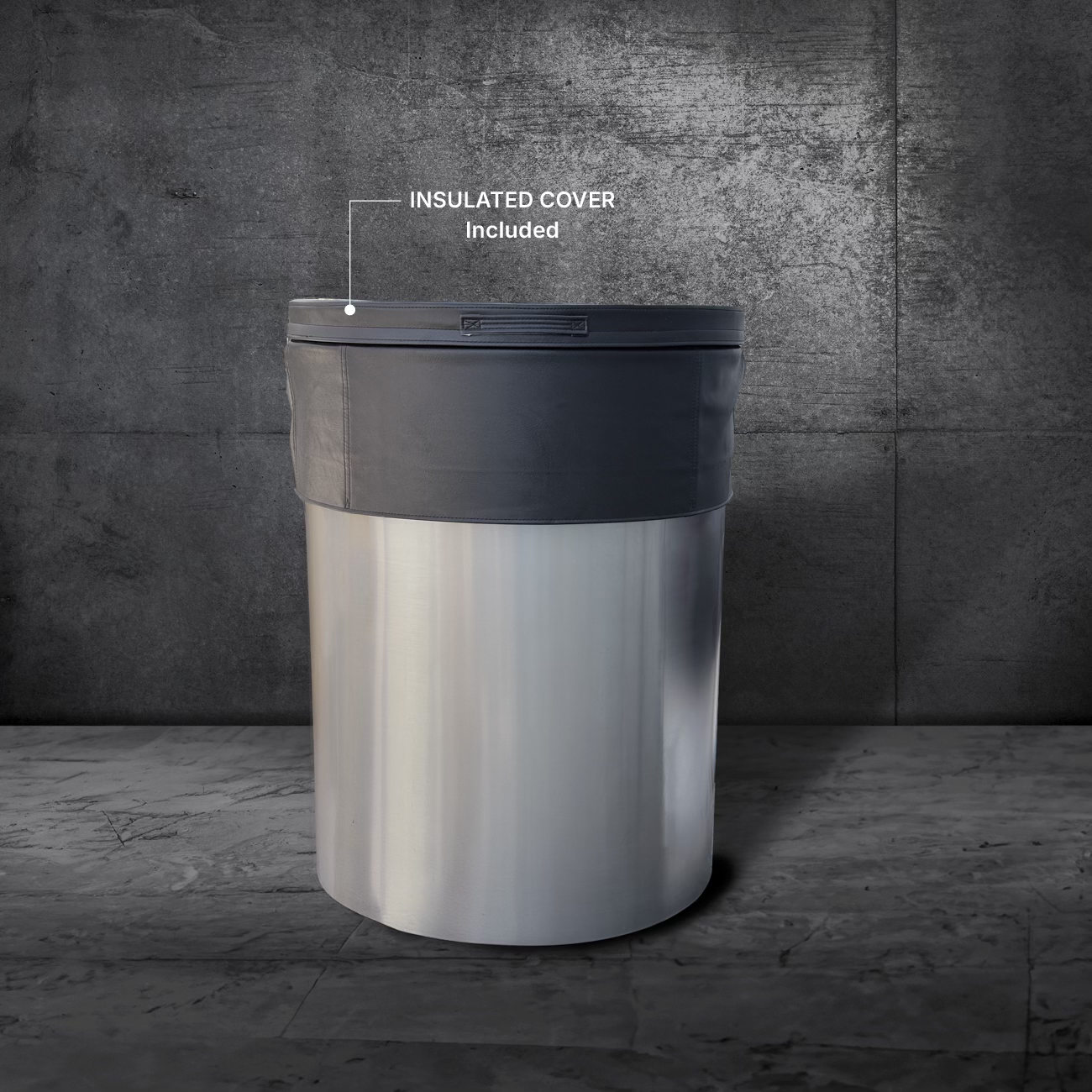 The Cyber Barrel Commercial Cold Plunge, a large marine-grade stainless steel unit with a dark insulated cover, stands on a gray marbled floor against a textured dark wall—ideal for cold plunge and optimal recovery routines.