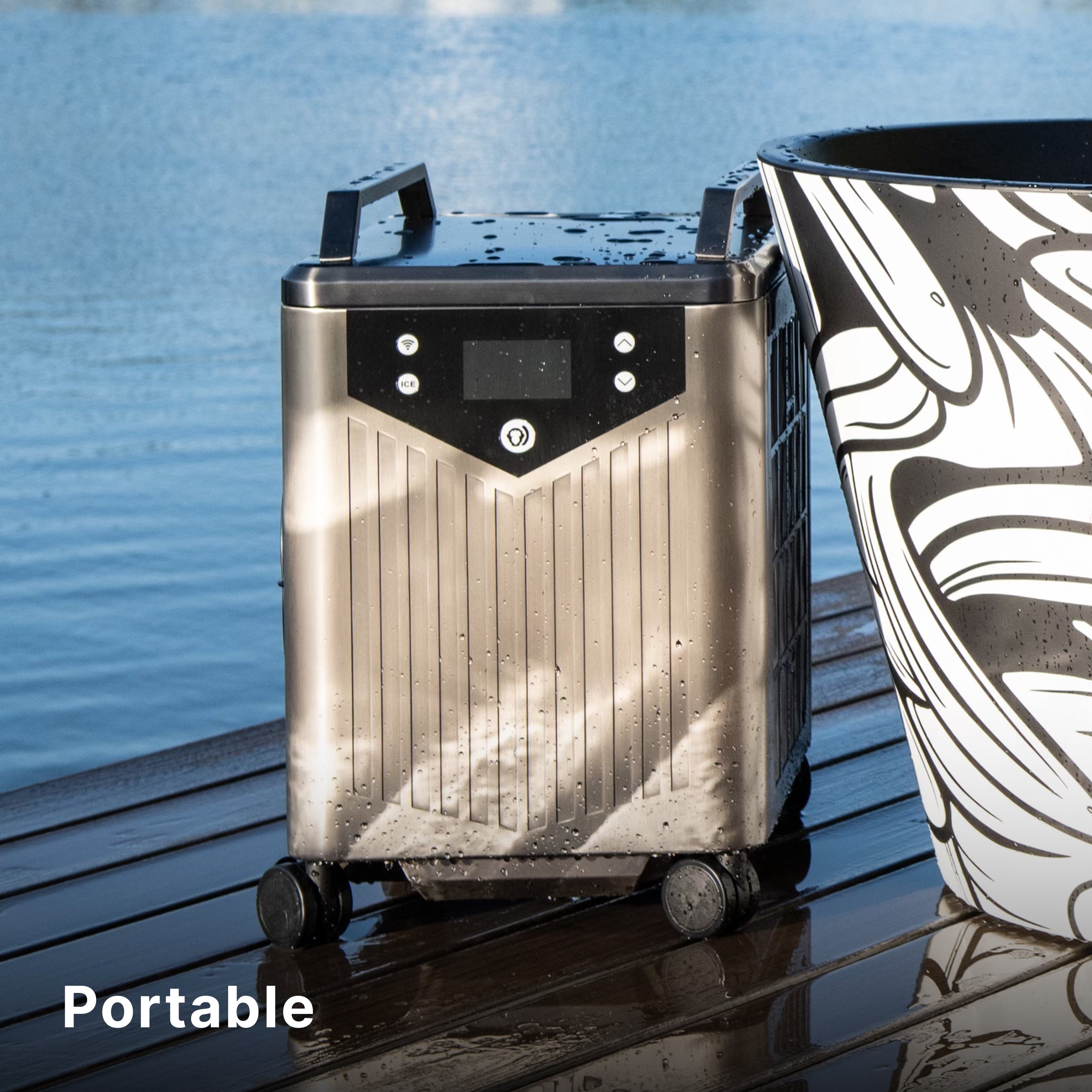 A stainless steel portable appliance with wheels and handles is on a wet wooden deck next to a black-and-white patterned object, with a body of water in the background. The word Portable is in the bottom left corner.