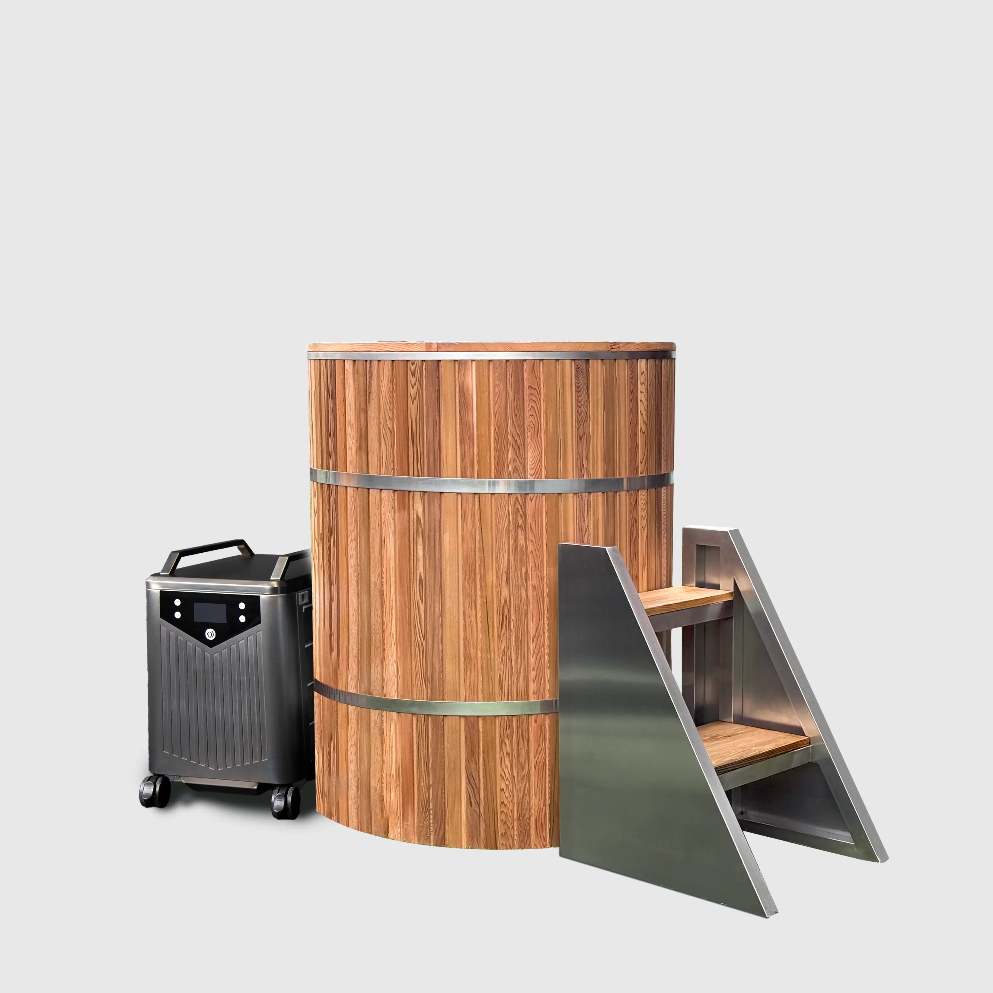 The Star Treatment 2.0 Cold Plunge features a barrel-shaped wooden tub with metal bands, a portable chiller unit on wheels, and two wooden-metal steps—perfect for compact spaces and shown against a plain light gray background.