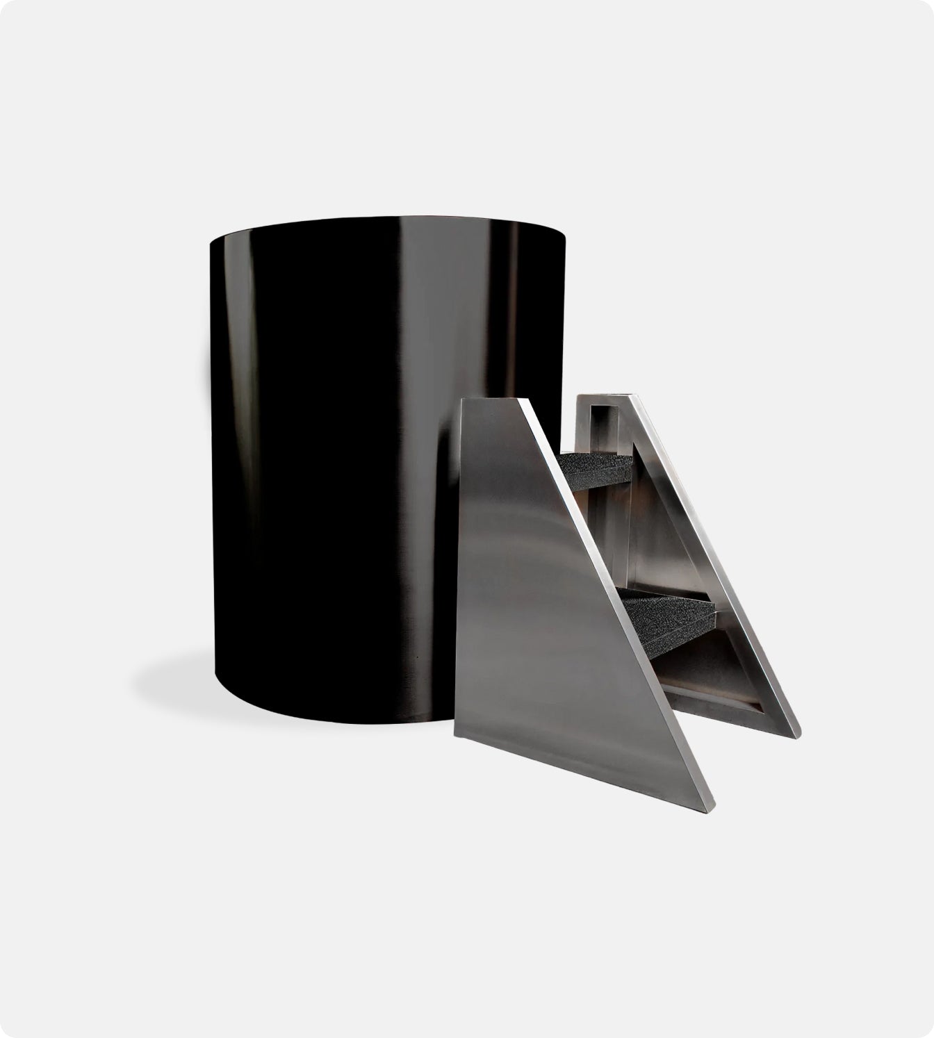 The Cyber Barrel Commercial Cold Plunge, a sleek black cylindrical unit, is displayed beside a modern stainless steel triangular staircase with three carpeted steps, all set against a plain white background.