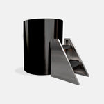 The Cyber Barrel Commercial Cold Plunge, a sleek black cylindrical unit, is displayed beside a modern stainless steel triangular staircase with three carpeted steps, all set against a plain white background.