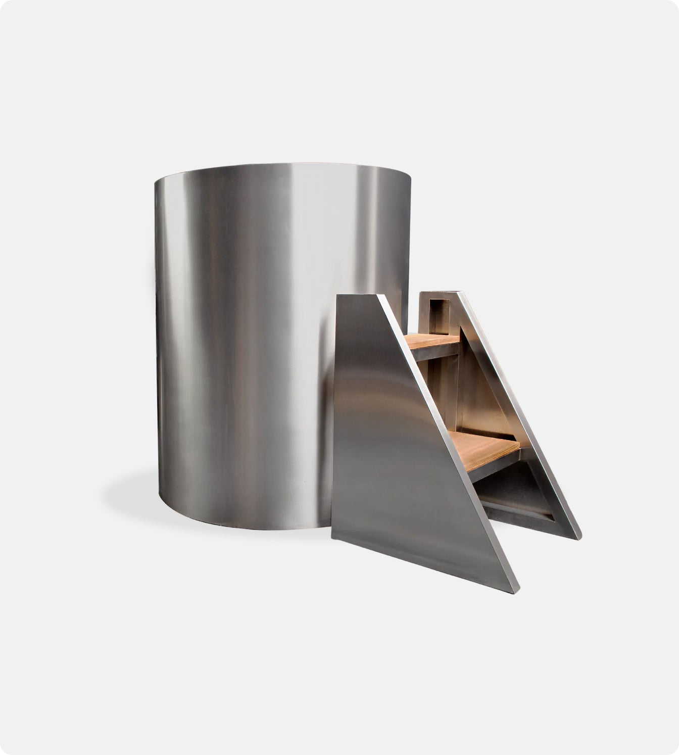 The Cyber Barrel Commercial Cold Plunge is a modern cylindrical stainless steel tub with a matching step stool featuring two wooden steps—perfect for cold immersion in commercial settings.