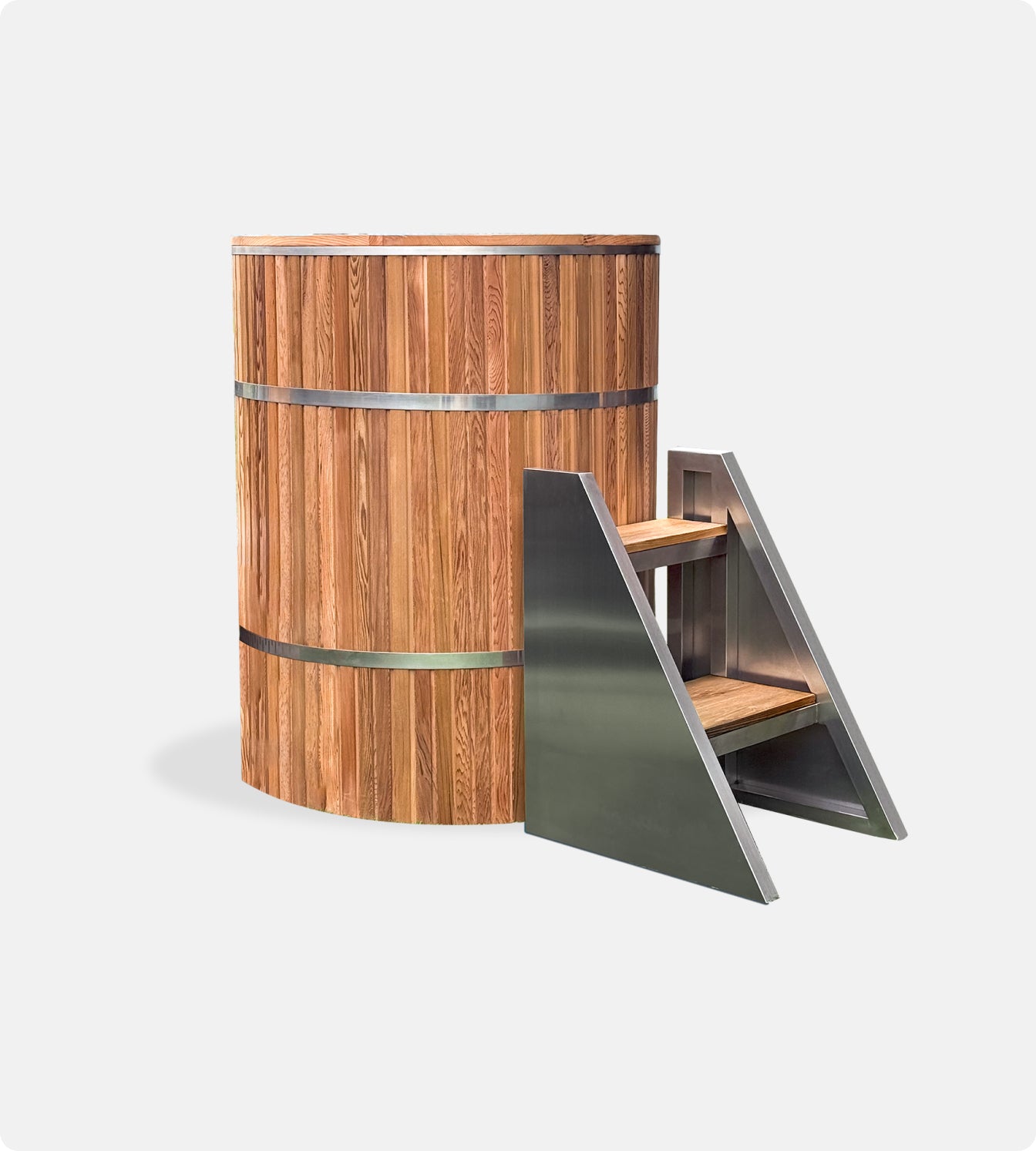 The Star Treatment 2.0 Commercial Cold Plunge is a tall, cylindrical wooden ice bath with stainless steel bands and a matching small metal staircase with wooden steps, set against a plain white background—ideal for cold plunge therapy.
