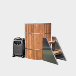 The Star Treatment 2.0 Commercial Cold Plunge features a wooden barrel-shaped tub with metal bands, a portable black and silver chiller unit on wheels, and modern angled wooden steps with stainless steel sides, set against a white background.