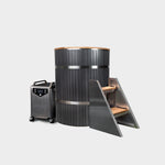 The Star Treatment 2.0 Commercial Cold Plunge features a modern cylindrical tub with dark vertical panels, a portable stainless steel chiller on wheels, and metal stairs with wooden steps, all set against a plain white background.