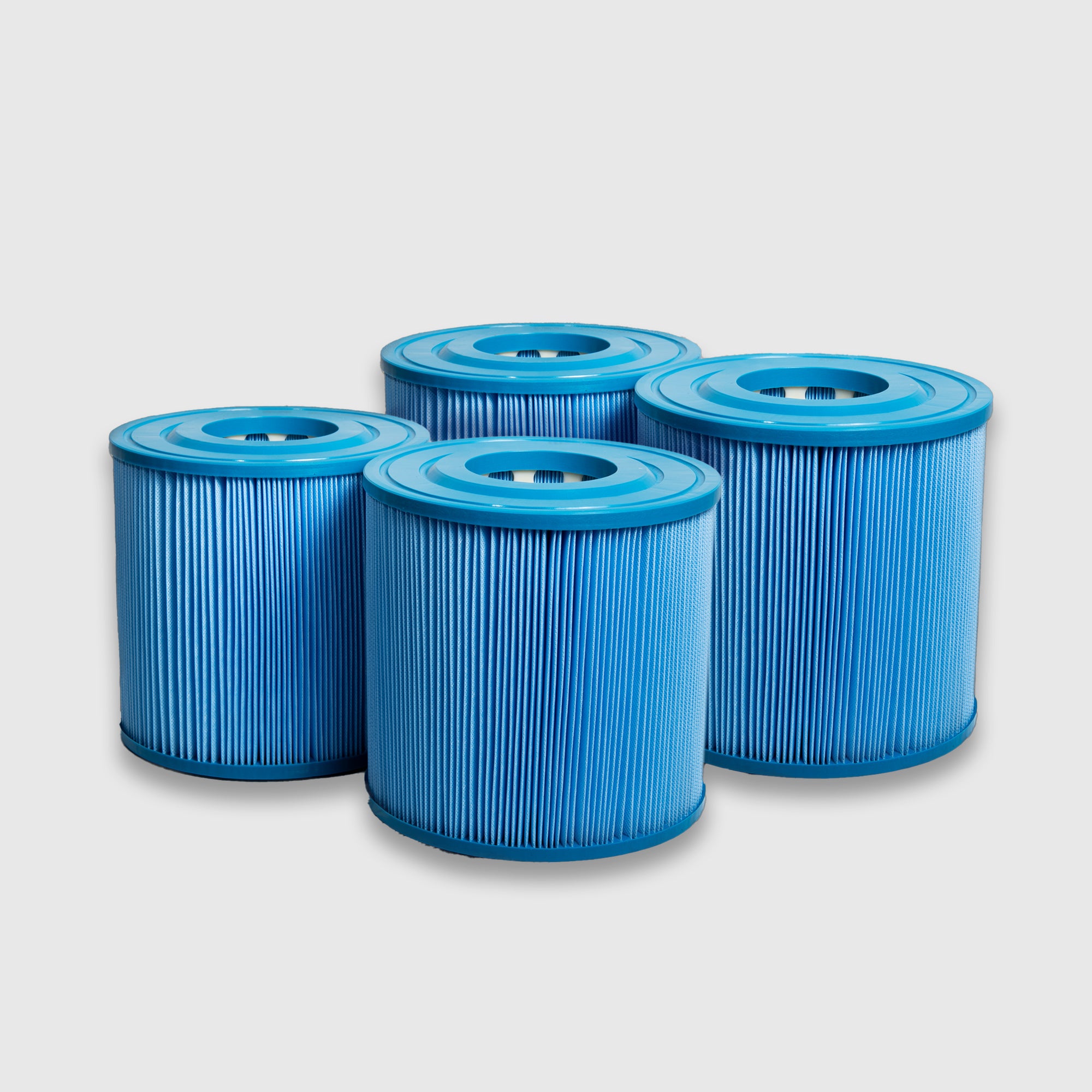 Two blue cylindrical Filter Replacement for Commercial Systems cartridges with pleated sides are shown together on a light gray background, perfect for maintaining clean water in commercial cold plunge systems.