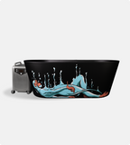 The Brainpod 2.0 Cold Plunge is a freestanding black tub with an artistic design of a blue-skinned, red-haired reclining woman and water splashes; a silver portable speaker sits to the left of the tub.