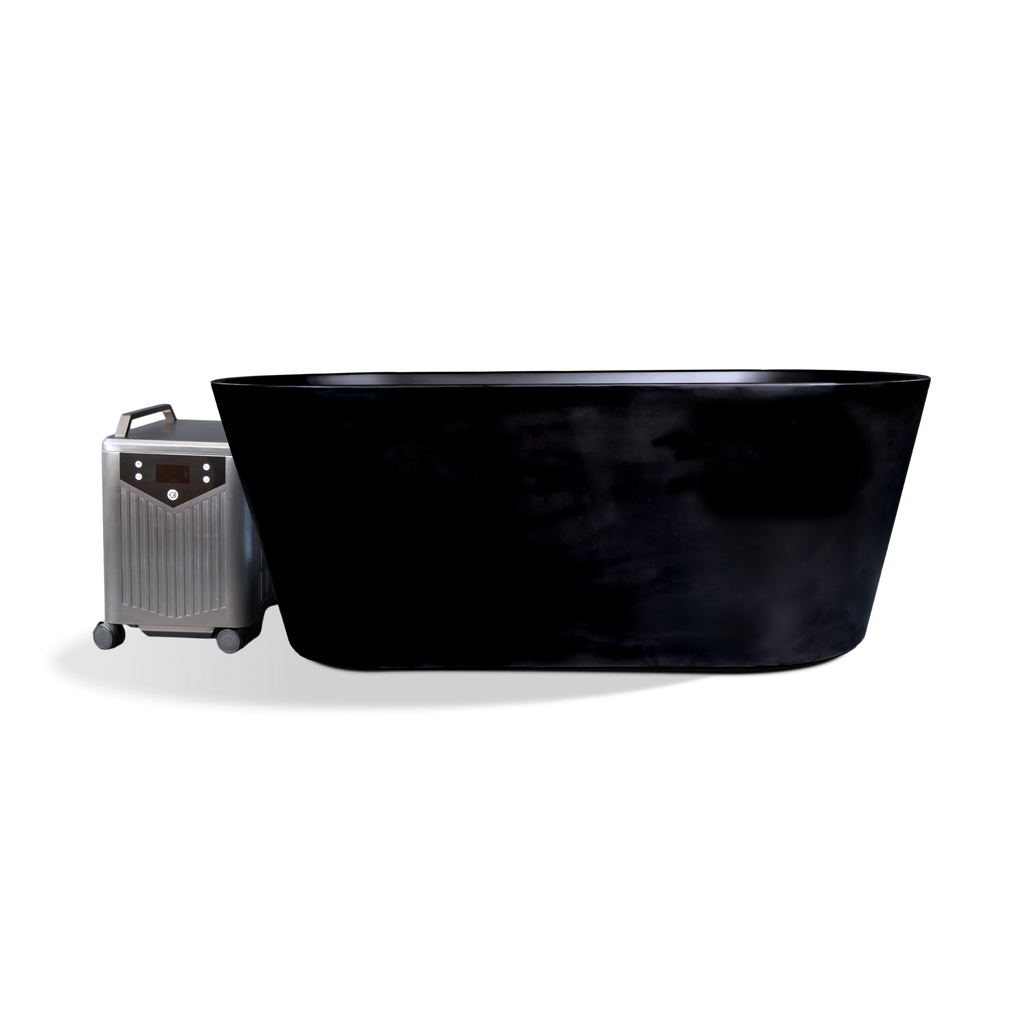 Black oval insulated acrylic Brainpod 2.0 Cold Plunge tub next to a small metallic chilling unit on wheels.