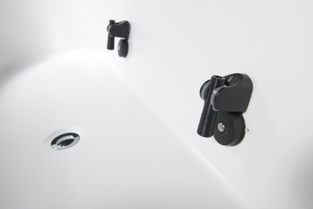 Close-up of the Brainpod 2.0 Cold Plunge, a white tub with a chrome drain and two black ergonomic rollers attached to the wall, designed for enhanced comfort and modern style.