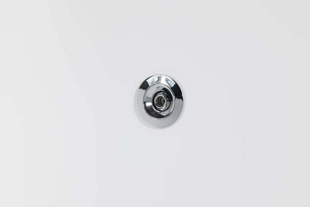 A close-up of the Brainpod 2.0 Cold Plunge, showcasing its circular, chrome-plated, ergonomic design mounted against a smooth white surface.
