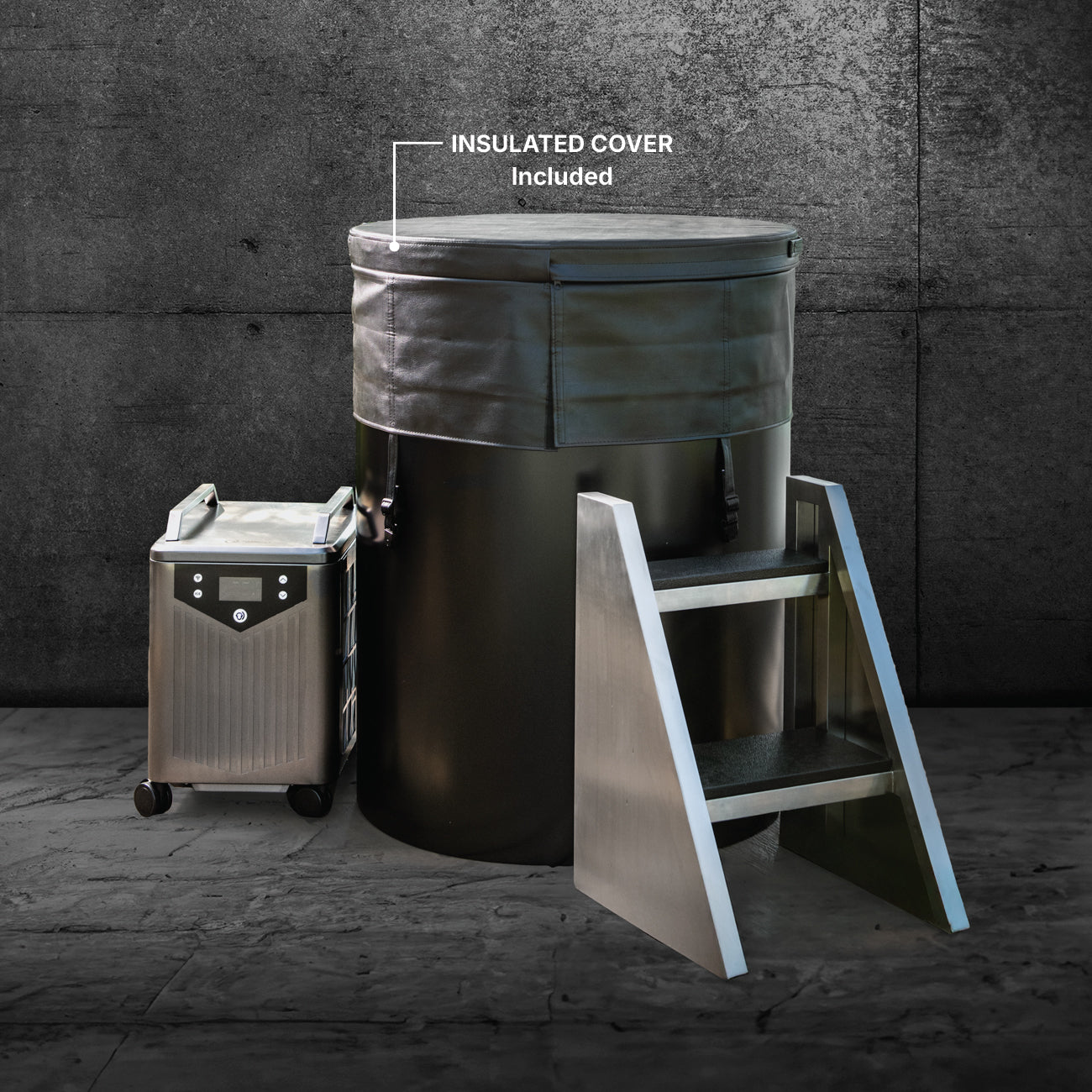 The Cyber Barrel is a large vertical cold plunge ice bath made from marine-grade stainless steel, featuring an insulated cover, metal entry steps, and a mobile control unit, all set in front of a dark concrete wall. The text highlights the included insulated cover.