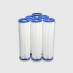 Six Filter Replacement for Residential Pro Systems cartridges with blue end caps and white pleated bodies stand upright on a light gray background—perfect for maintaining pro-level cooling in cold plunge systems.