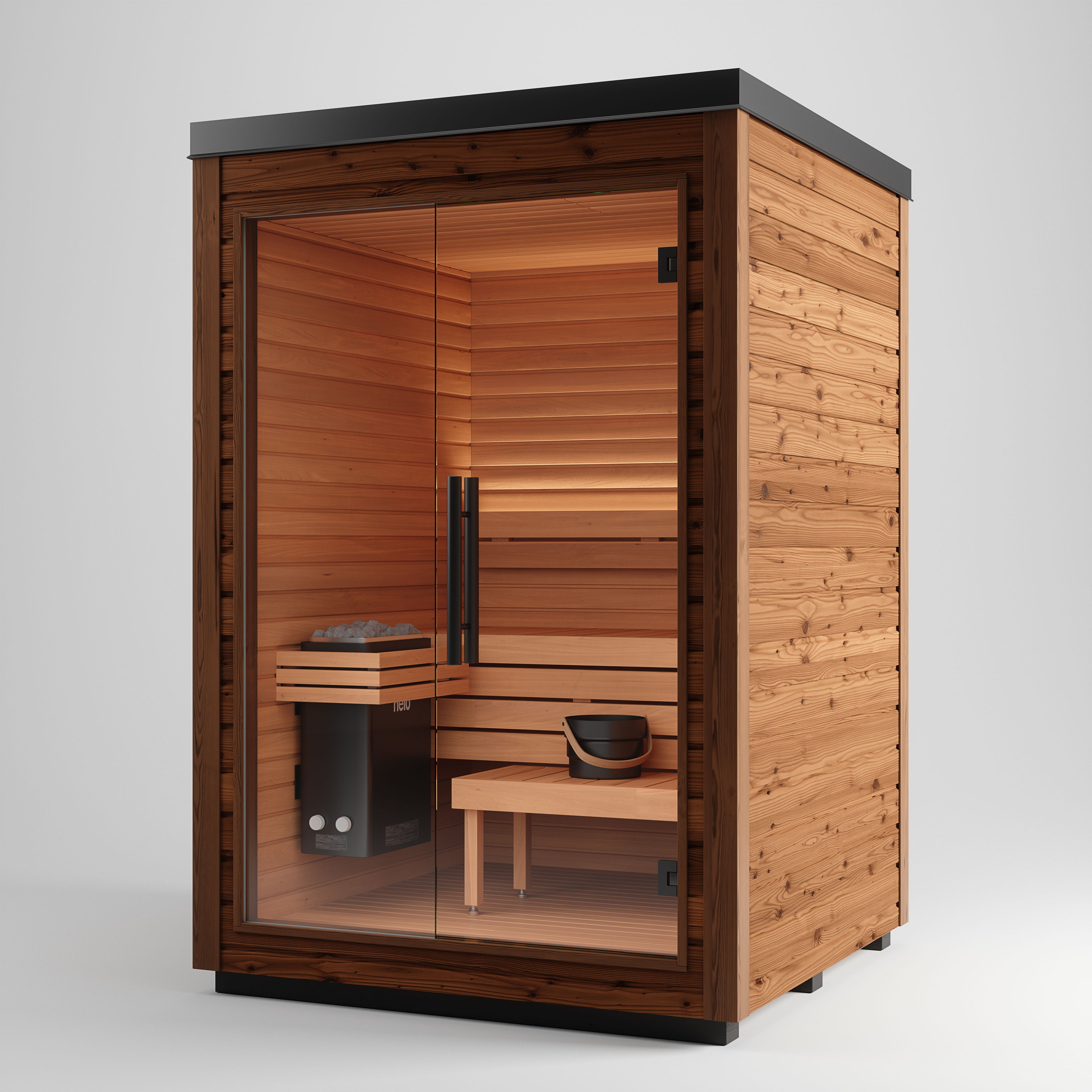 The Aura Auroom Sauna is a small, modern outdoor cabin with horizontal wood paneling, a sleek black flat roof, glass front door, interior bench, sauna heater, and a bucket with ladle for heat therapy.