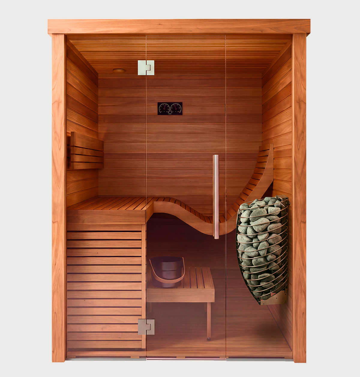 The Baia Glass Sauna features a modern design with a glass door, a bench with a curved backrest, and includes both a bucket and ladle. On the right side, sauna stones are elegantly arranged in a sleek metal holder. This clean and well-lit sauna provides comfort and contemporary style.
