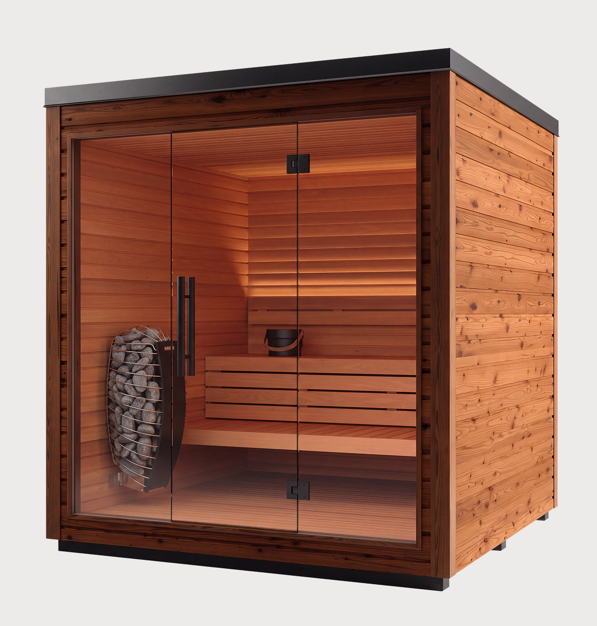 The Sauna + Cold Plunge Bundle features a wooden sauna with glass doors, interior benches, and a bucket on the seat—making it perfect for your home recovery setup. A heater with sauna stones is positioned to the left inside, while warm brown wood panels create an inviting space ideal for pairing sauna and cold plunge sessions or incorporating contrast therapy into your wellness routine.
