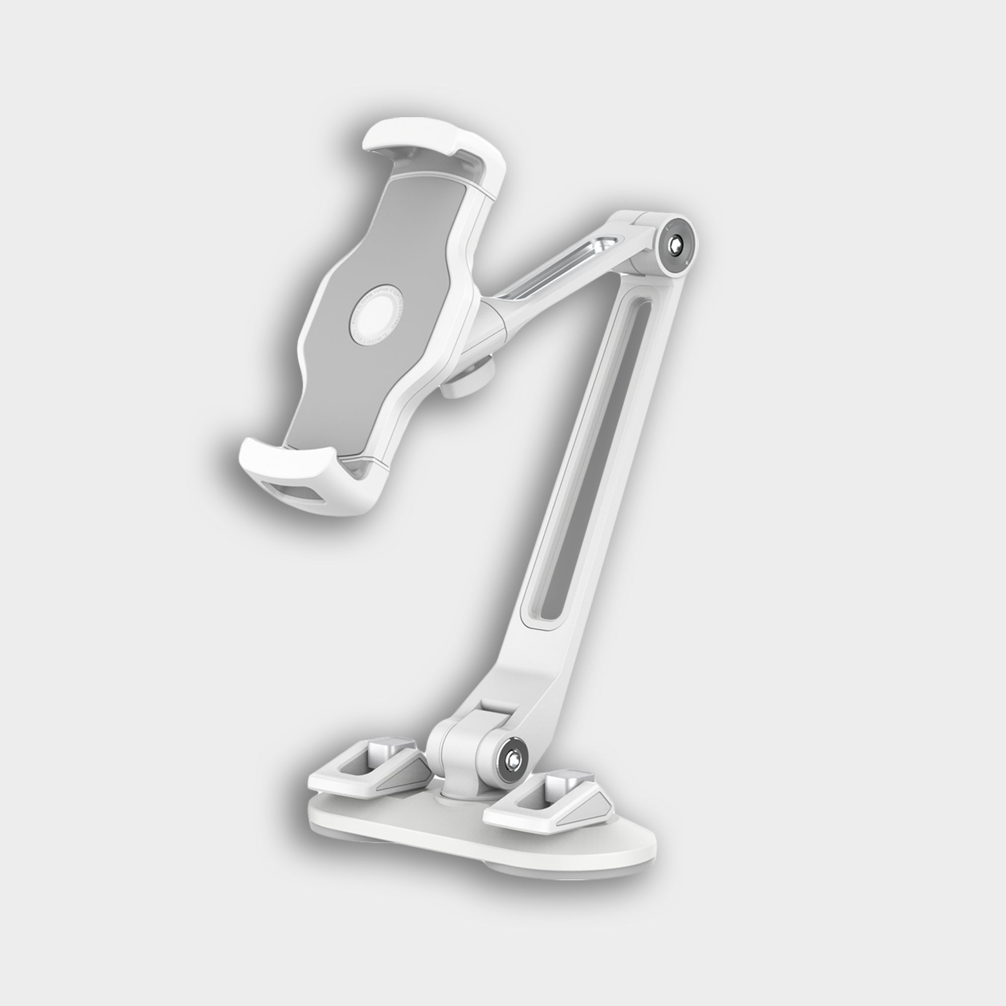 The Smart Device Holder is a white adjustable stand for tablets or phones, featuring suction cups, a sturdy base, articulated arm, and padded grip clamps. Displayed against a plain light gray background.