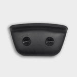 A black, rectangular Waterproof Pillow with a curved top and two round buttons on its front, reminiscent of Polar Monkeys cold plunge gear, set against a plain white background.