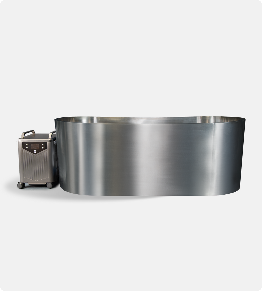 The Cyber Plunge Cold Plunge, a large oval tub made of 316 marine-grade stainless steel with an ultra-spacious interior, is displayed next to its portable chiller unit on wheels against a plain white background.