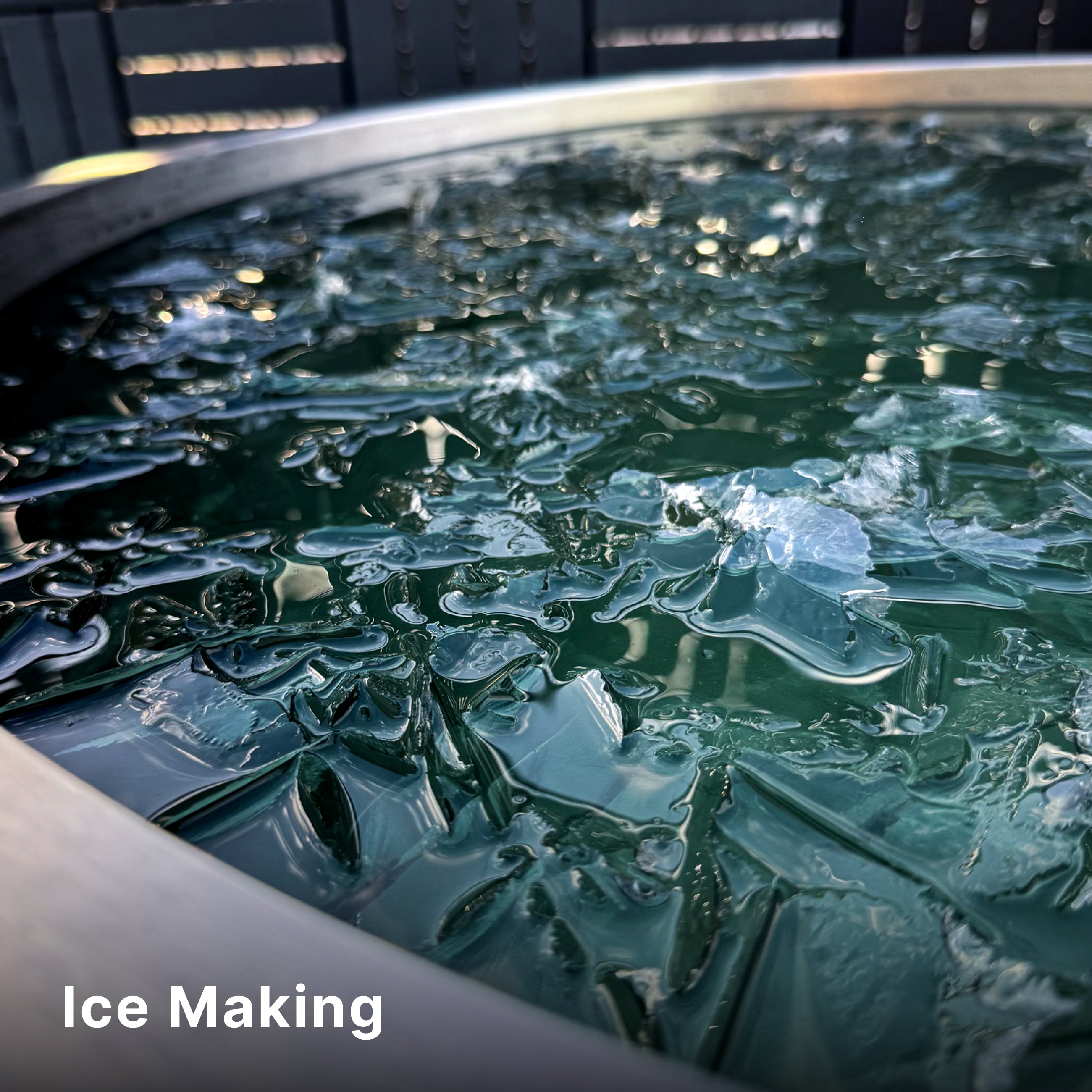 A close-up view of a round tank filled with water and forming ice crystals on the surface, with the words Ice Making in white text at the bottom left corner.