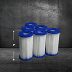 Six Filter Replacement for Residential Standard Systems cartridges (6 Pack) with blue rims are arranged in two rows on a textured gray surface. Each 5-inch filter is designed for broad compatibility with various cold plunge models.