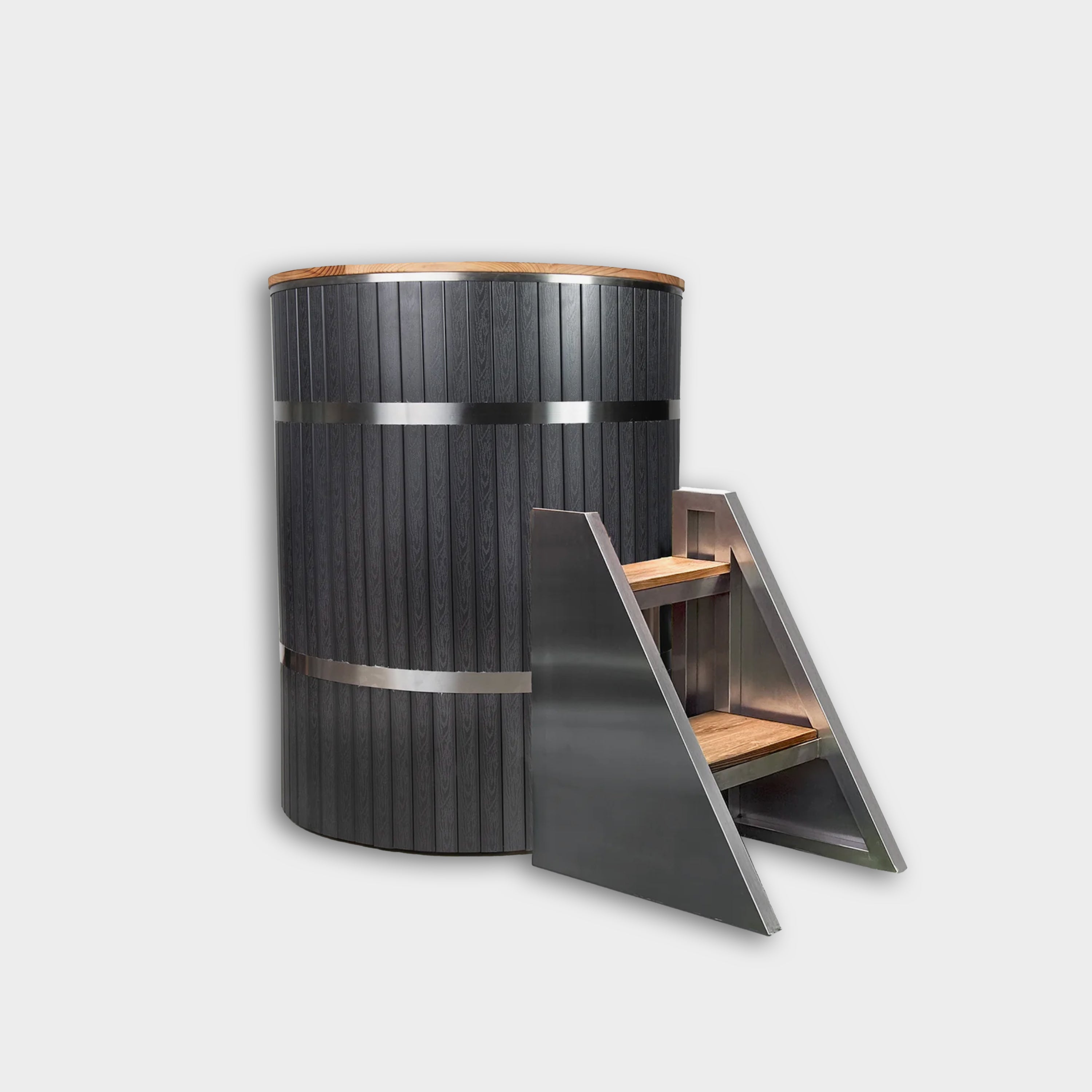 The Star Treatment 2.0 Commercial Cold Plunge is a tall, round black tub with stainless steel bands and wood accents, plus a matching two-step wood and metal staircase for easy access—ideal for cold therapy sessions. Shown on a plain white background.