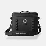 The Cave Cooler, a black soft cooler bag featuring leak-proof insulation, a handle, shoulder strap, and the Polar Monkeys logo on the front, is photographed against a plain light background.