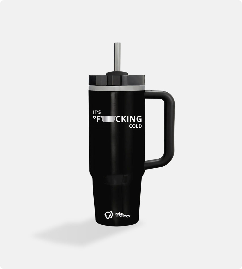 A large 40oz black Polar Monkeys Tumbler with a handle and silver straw, featuring "ITS F**KING COLD" (partially censored) on the mug and the Polar Monkeys logo at the bottom.