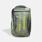 The Vault Backpack is a gray ergonomic bag with yellow polar. monkeys text and logo, multiple zippered compartments, a top handle, and a front strap featuring a yellow carabiner.